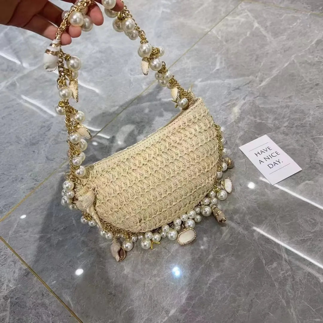 Woven Bag with Pearl and Shell detail Front in hand